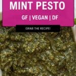 A close-up of a bowl filled with vibrant mint pesto. The overlay text reads: Quick & Easy Mint Pesto, GF | Vegan | DF, Grab the Recipe! with a small logo at the bottom.