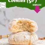 Three powdered sugar-coated Italian almond cookies with almond flour are stacked, the top one showing a bite revealing a soft, moist interior. Text above reads, Italian Almond Cookies (GF) Download.