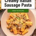 A bowl of creamy Italian Sausage Pasta with grated cheese and herbs sits on a table next to another dish. Text overlay reads: “Quick & Easy Creamy Pasta with Spinach. Grab the recipe!”.