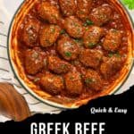 Overhead view of a white pan filled with Soutzoukakia—Greek beef meatballs in tomato sauce, garnished with herbs. Text overlay reads Quick & Easy Greek Beef Meatballs. Parsley and a striped towel are nearby.