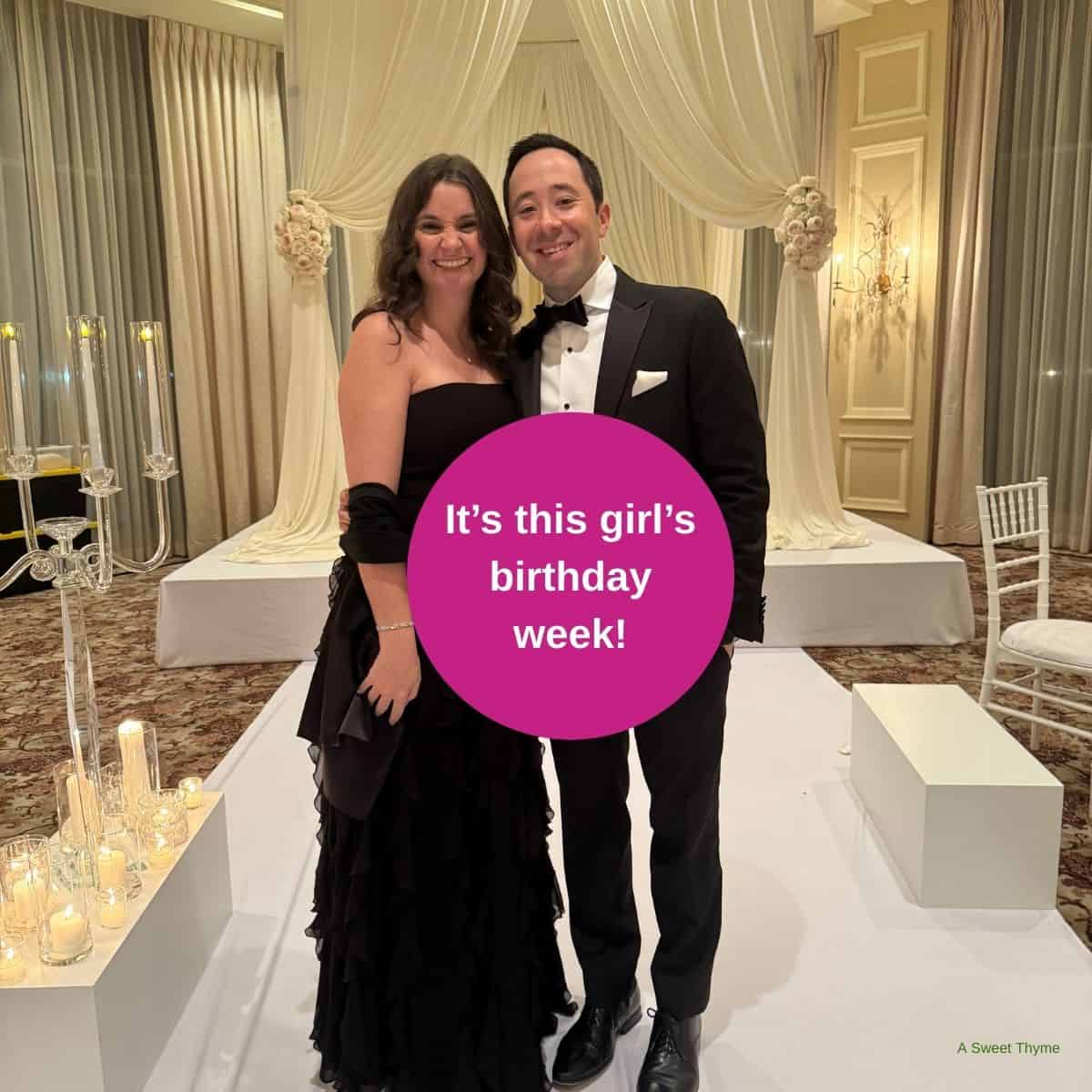 A woman in a black dress and a man in a tuxedo smile and pose together at an elegant indoor event. A pink circle reads, It’s this girl’s birthday week! Candles, flowers, and The Sunday Thymes set the festive mood.