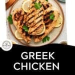 Grilled chicken breasts garnished with parsley and lemon slices on a plate, showcasing Greek chicken with yogurt marinade, with text reading “Greek Chicken with Yogurt Marinade” and a “Download Now” button below.