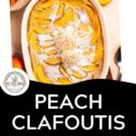 Overhead view of a peach clafoutis topped with powdered sugar and cream, surrounded by fresh peach slices. Text reads: Peach Clafoutis with Bourbon & Cream. Discover this irresistible peach clafoutis—download now.