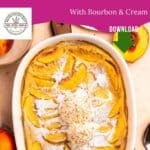 A baked peach clafoutis in a white dish, sprinkled with powdered sugar and topped with whipped cream, sits on a table with fresh peach slices. Text reads: Peach Clafoutis with Bourbon & Cream—an irresistible summer dessert.