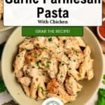 A bowl of creamy garlic parmesan pasta with chicken, garnished with herbs, surrounded by small bowls of grated cheese, spices, and parsley, with text overlay promoting the recipe.