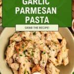A bowl of creamy garlic parmesan pasta with chicken, topped with fresh parsley, sits invitingly on a table. Parmesan cheese and seasonings are visible nearby, adding to the savory appeal. A green banner reads Garlic Parmesan Pasta with Chicken with a Grab the Recipe! label.