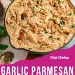 A skillet filled with creamy garlic parmesan pasta with chicken pieces, garnished with parsley, sits on a wooden surface next to fresh herbs. Text on the image reads With Chicken Garlic Parmesan Pasta.