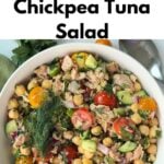A bowl of vibrant chickpea tuna salad with cherry tomatoes, cucumbers, red onions, fresh herbs, and zesty lemon slices. Text above reads Without Mayo! Chickpea Tuna Salad. A serving spoon and leafy garnish are beside the bowl, completing this refreshing chickpea tuna salad presentation.