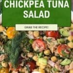 A vibrant bowl of chickpea tuna salad featuring crisp cucumber, juicy tomatoes, red onion, dill, and parsley. Green and white text reads, Without Mayo! Chickpea Tuna Salad. Grab the recipe!.