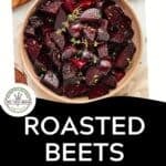 A bowl of roasted beets garnished with herbs sits on a white surface. The text below reads: Roasted Beets with Garlic, Lemon, & Honey. Download Now for this delicious roasted beets recipe. There is also a small Tried-Tested-Never AI badge.
