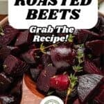 A wooden spoon serves roasted beets garnished with fresh thyme. Text overlay reads Roasted Beets: With Garlic, Lemon, & Honey. Grab the recipe! A flavorful sauce and a green badge are also visible.