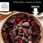 A bowl of roasted beet chunks garnished with fresh herbs takes center stage, surrounded by small dishes. The text above reads: Roasted Beets with Garlic, Lemon, & Honey. Download this inviting image featuring delicious roasted beets today.