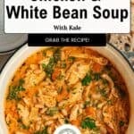 Large bowl of Chicken and White Bean Soup with kale, shredded chicken, beans, carrots, and fresh herbs. Text above reads Chicken & White Bean Soup with Kale. Grab the recipe! Tender braised chicken thighs are shredded into the broth for extra flavor. Sliced bread and a small dish of chopped herbs nearby complete this comforting meal.