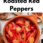 A wooden bowl of roasted red peppers with sliced garlic and herbs, surrounded by bread, a fork, and small bowls of spices. Text above reads, Roasted Red Peppers with Honey, Garlic and Thyme. This vibrant dish highlights the irresistible flavor of roasted red peppers paired with aromatic thyme and a touch of honey.