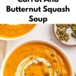 Overhead view of two bowls of warm spiced carrot and butternut squash soup, garnished with a swirl of cream, herbs, and pumpkin seeds.