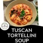 A bowl of creamy Tuscan Tortellini Soup with sausage and spinach, featuring a text overlay of the recipe name and a Download Now button.