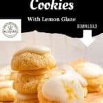 Stack of lemon ricotta cookies drizzled with lemon glaze on parchment paper, including a recipe download link.